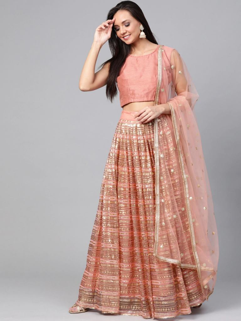 Peach-coloured and golden lehenga choli with dupatta